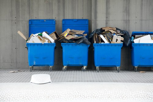 Bulky waste collection team removing large furniture from a London property