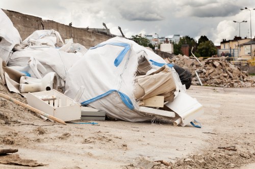 Furniture clearance team handling bulky items in a London home