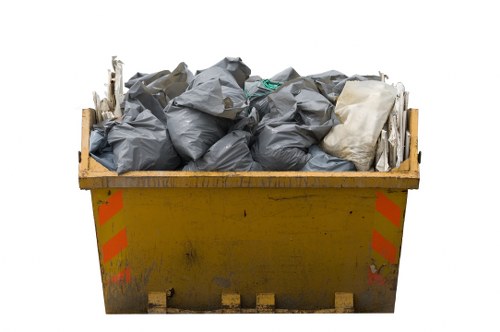 Professional waste clearance team handling bulky rubbish removal in a London street