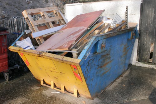 Local team handling bulky furniture removal on a London street
